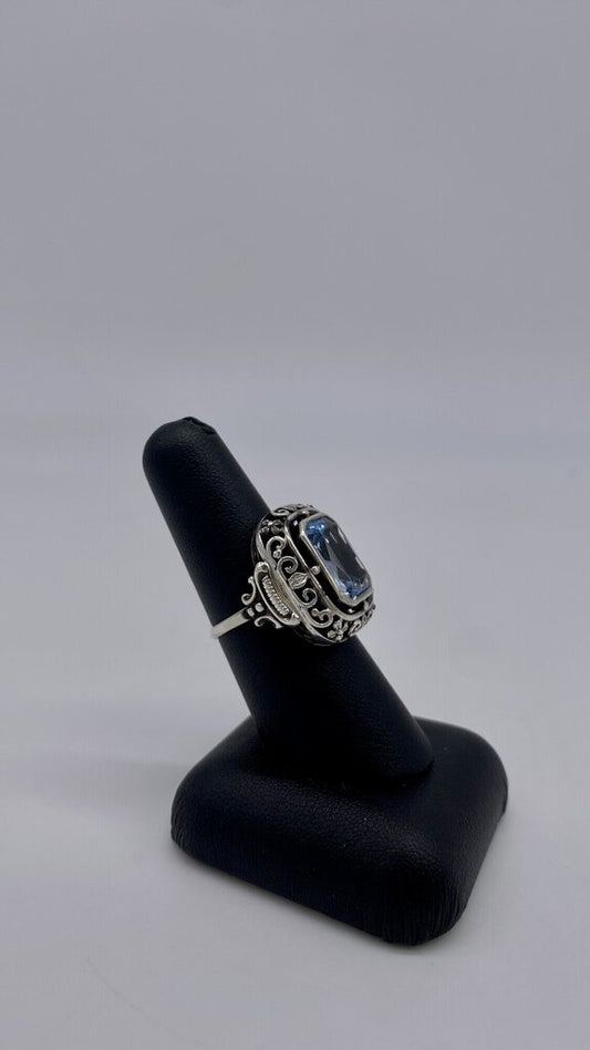 Ss Blue Topaz Scroll Halo